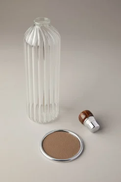 Water bottle with coaster and cap in zebu